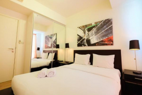 Homey 2BR Apartment at Casa Grande Residence By Travelio
